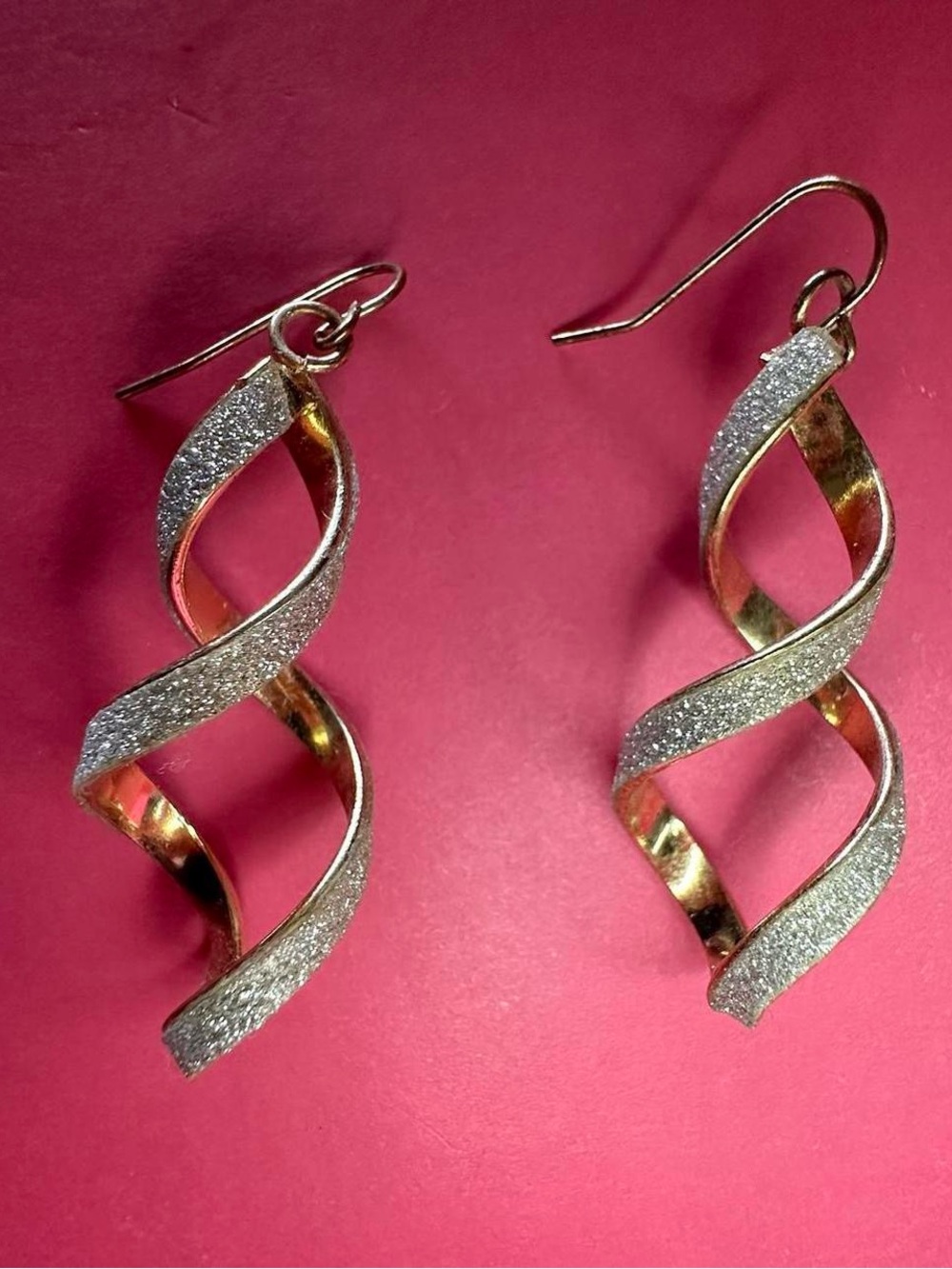 Spiral glittery dangling earrings.